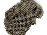 chain mail bag on a white background with clippings on it