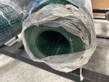 a roll of fabric wrapped in plastic sitting on a rack