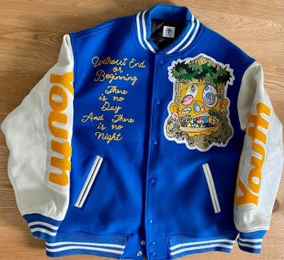 a blue and white jacket with a picture of a person on it
