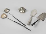 four different types of kitchen utensils on a white surface