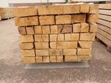 several pieces of wood stacked on top of each other in a pile