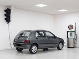 a car that is parked in a room with a gas pump