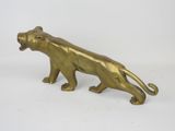 brass figurine of a tiger on a white background