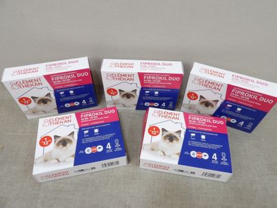 four boxes of catnip for cats sitting on a table