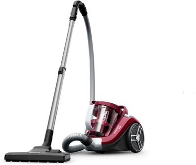 un aspirateur rouge et argent posé sur un sol blanc