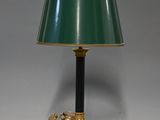 an image of a table lamp with a green shade on top of it