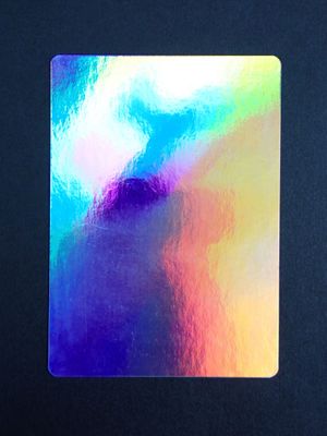 an image of a close up of a sticker on a black surface