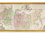 an old map of the world in a wooden frame