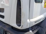 a large white truck parked on the side of the road
