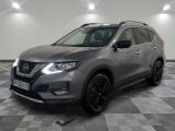 the nissan suv is parked in a large room with a checkered floor