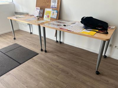 a table with a bag on it in a room