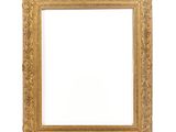 a gold frame with a white background and a white wall