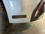 a close up of a car ' s bumper with a sticker on it