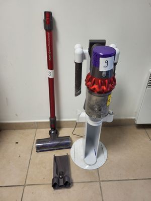 a vacuum that is sitting on the floor next to a vacuum