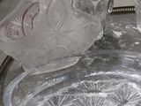 a glass bowl and a glass plate on a table