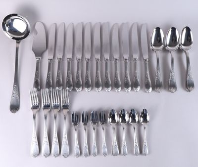 a lot of silver spoons and spoons on the table