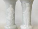 two vases that are sitting side by side on a table