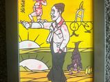 painting of a man holding a baby in his arms in a black frame