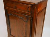a small wooden cabinet with a drawer on top of it