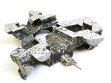 several pieces of metal that are sitting on top of a white surface