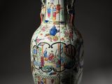 a large vase with a painting on it sitting on a table