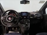 a dashboard of a small car with a steering wheel