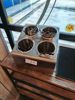 a picture of a counter with three pots of food on it