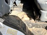 a small bird that is sitting on the floor of a car