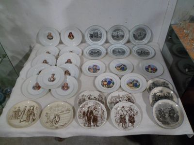 a lot of plates that are sitting on a table