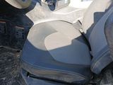 a seat in the back of a vehicle with a yellow seat belt