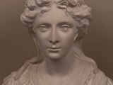 marble bust of a woman with a hat on top of her head