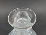 a clear glass vase with a clear top on a table