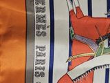 a tie with a picture of a man riding a horse on it
