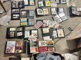 a lot of cds and cds in a box on the floor