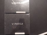 two laptops sitting on top of a table next to each other