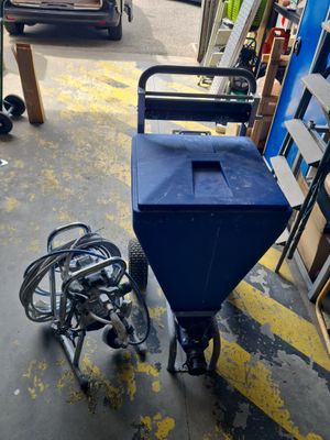 a blue cart that is sitting in a garage