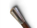a baseball bat with a wooden handle on a white surface