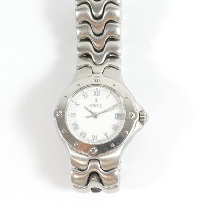 a close up of a watch on a white surface with a white background