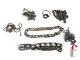 a lot of metal items that are on a white surface
