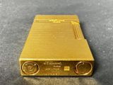 a close up of a gold plated electronic device on a table