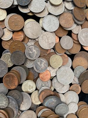 a lot of coins that are sitting on a table