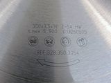 a close up of a metal plate with a circular design on it