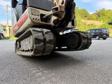 a bulldozer that is parked on the street