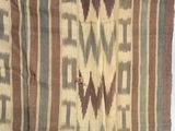 an image of a brown and green cloth with a design on it