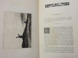 an open book with a picture of a man on a cliff