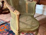a chair that is sitting on a rug in a room