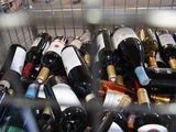 many bottles of wine in a shopping cart