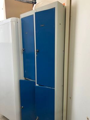 two blue lockers next to each other in a room