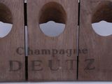 three wine bottles that have holes in them