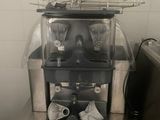 a machine that is sitting on a counter in a kitchen